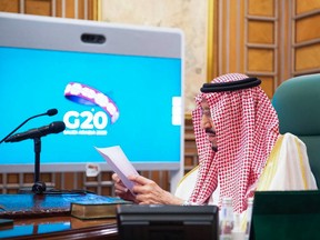 Saudi King Salman bin Abdulaziz chairs an emergency G20 videoconference, in the capital Riyadh, on March 26.
