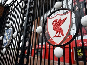 A locked gate is seen at the Liverpool football club's stadium in Liverpool, England, on April 18.