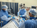 Mississauga Hospital SWOT team staff members, left to right, Frederick Leung, respiratory therapist, Dr. Jurgita Markus, anesthesiologist and Jeffrey Lainez, registered nurse, demonstrate the intubation procedure being used on COVID-19 patients.