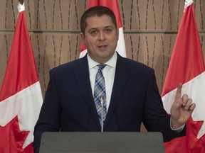 Leader of the Opposition Andrew Scheer gestures to reporter as he speaks during a news conference in Ottawa, Tuesday April 14, 2020.