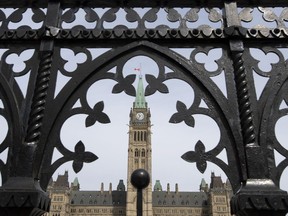 The Parliament buildings are seen in Ottawa, Monday, April 27, 2020. In addition to one limited in person session, Parliament is scheduled to begin sitting virtually twice a week Tuesday in response to the COVID-19 pandemic.