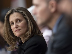 Deputy Prime Minister and Minister of Intergovernmental Affairs Chrystia Freeland listens to a speaker during a news conference in Ottawa, Tuesday April 7, 2020. The day after Prime Minister Justin Trudeau's wife was revealed to have COVID-19, cabinet agreed that Deputy Prime Minister Chrystia Freeland should be next in line if Trudeau were unable to perform his duties.
