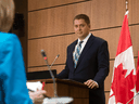 Opposition Leader Andrew Scheer listens as a reporter asks a question during a news conference in Ottawa, April 14, 2020.