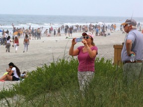People take advantage of a Duval County beach opening for physical activity amid coronavirus disease (COVID-19) restrictions in Jacksonville, Florida, U.S. April 19, 2020. REUTERS