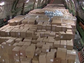 Boxes with medical equipment and masks to help fight coronavirus disease (COVID-19) are seen on board a Russian military transport plane ahead of its departure to the United States of America, at an airdrome outside Moscow, Russia April 1, 2020, in this screen grab taken from video.