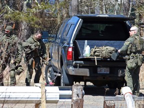 RCMP members pack up after the search for Gabriel Wortman in Great Village, Nova Scotia, Canada April 19, 2020.