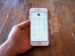 A hand holds an iPhone with the Chronically Simple app open