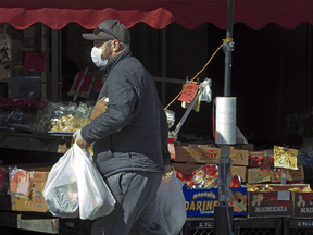 A shopper on Toronto's Danforth Avenue.