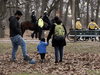 Mounted unit and by-law enforcement officers patrol Toronto’s High Park to enforce social distancing and keep people moving on April 5, 2020.