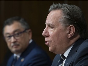 Quebec Premier François Legault, with public health director Horacio Arruda.