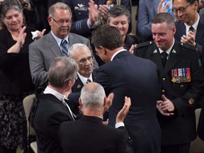 Prime Minister of the Netherlands Mark Rutte speaks with Royal Canadian Dragoons veteran Donald White, who helped liberate Holland, after speaking to the House of Commons in Ottawa, Thursday, October 25, 2018.