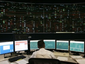 An operator works in the control room at the Independent Electricity System Operator facility in Mississauga, Ont. on Oct. 6, 2005. A group of personnel key to keeping Ontario's electricity system functioning may end up locked down in their control centres due to the COVID-19 crisis, according to the head of the province's power operator.