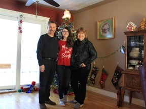 Deb Diemer, 57, right, poses for a photo with her husband Mike Diemer and her daughter 18-year-old daughter Helena in this handout image in Calgary. Calgary woman who died of COVID-19 was expecting 2020 to be best year: husband Mike Diemer of Calgary says he and his wife were expecting 2020 to be the best year of their lives.