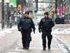 Police officers patrol downtown Calgary on April 2, 2020 as part of their regular patrol. Police have been on the watch for criminals breaking into shops that are closed due to the coronavirus outbreak.