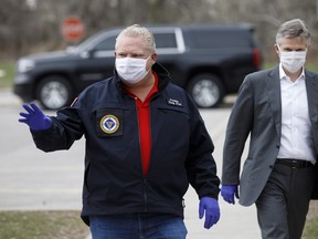 Doug Ford, Ontario's premier, wears a protective mask as he arrives at an event to hand out meals provided by Maple Leaf Sports & Entertainment (MLSE) to healthcare workers outside Centenary Hospital in Toronto on Friday, April 24.
