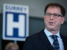 British Columbia Health Minister Adrian Dix speaks before Premier John Horgan announces a new hospital would be built in Surrey, B.C., on Monday December 9, 2019.