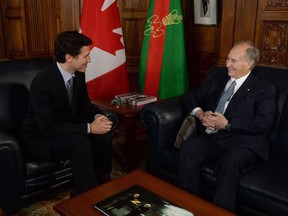 Prime Minister Justin Trudeau meets with the Aga Khan on Parliament Hill in Ottawa on Tuesday, May 17, 2016. An appeal court says there's no need for the lobbying commissioner to take another look at whether the Aga Khan broke the rules by giving Prime Minister Justin Trudeau a vacation in the Bahamas.