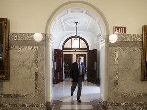 Alberta Premier Jason Kenney makes his way to the chamber as the Alberta Legislature sits through the weekend to pass a series of emergency bills, in Edmonton on Friday, March 20, 2020. The Alberta Medical Association has filed a lawsuit against the provincial government after it went ahead with changes to how doctors can bill for their services.