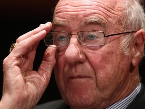 Retired justice Thomas Braidwood adjusts his glasses as he listens to a question after releasing his final report into the Taser-related death of Robert Dziekanski in Vancouver, B.C., on Friday June 18, 2010.