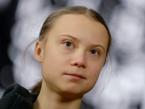 Swedish climate activist Greta Thunberg talks to the media before meeting with EU environment ministers in Brussels, Belgium, March 5, 2020.