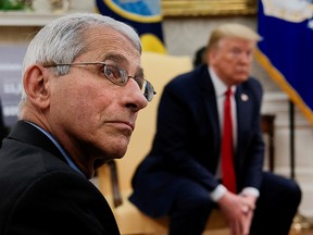 National Institute of Allergy and Infectious Diseases Director Dr. Anthony Fauci attends a coronavirus response meeting between U.S. President Donald Trump and Louisiana Governor John Bel Edwards in the Oval Office at the White House in Washington, U.S., April 29, 2020.