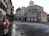 A municipal worker disinfects Piazza del Duomo, in Florence, Italy, to fight the spread of COVID-19, March 21, 2020.