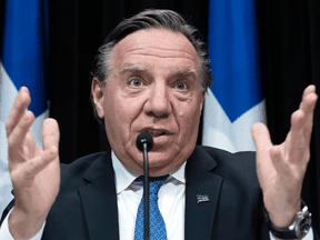 Quebec Premier Francois Legault responds to reporters during a news conference on the COVID-19 pandemic, April 2, 2020 at the legislature in Quebec City.