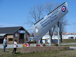 People pay their respects at 12 Wing Shearwater in Dartmouth, N.S., home of 423 Maritime Helicopter Squadron, on Thursday, April 30, 2020. A CH-148 Cyclone helicopter flying from the Halifax-class frigate HMCS Fredericton crashed in the Ionian Sea between Italy and Greece while taking part in an exercise as part of a NATO operation in the Mediterranean.