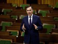 Canada's Minister of Finance Bill Morneau speaks in the House of Commons as legislators convene to give the government power to inject billions of dollars in emergency cash to help individuals and businesses through the economic crunch caused by the novel coronavirus outbreak, on Parliament Hill in Ottawa, Ontario, Canada March 25, 2020.