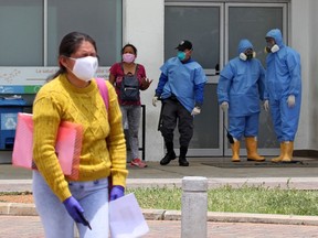 A woman cries outside the Guasmo Sur hospital in Guayaquil, Ecuador, on April 4, 2020 during the novel coronavirus COVID-19 pandemic.