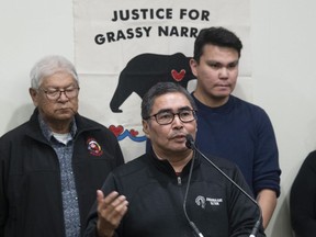 Grassy Narrows elder Bill Fobister Sr. and youth representative Rodney Bruce look on as Chief Rudy Turtle speaks during a news conference at the AFN Special Chiefs Assembly in Ottawa on December 3, 2019. The federal government has signed an agreement with Grassy Narrows First Nation that will see a long-promised treatment centre for residents with mercury poisoning finally built in the community. Chief Rudy Turtle signed the framework agreement with Indigenous Services Canada Thursday, which commits $19.5 million towards the construction of the mercury care home. Indigenous Services Minister Marc Miller says the facility will provide access to health services to meet the needs of community residents who are living with methylmercury poisoning.