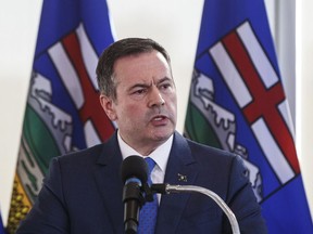 Alberta Premier Jason Kenney speaks during a press conference in Edmonton on February 24, 2020. Alberta Premier Jason Kenney says his province has more than enough protective masks, gloves and ventilators for its own COVID-19 needs, so it's sharing some of its surplus with other provinces.