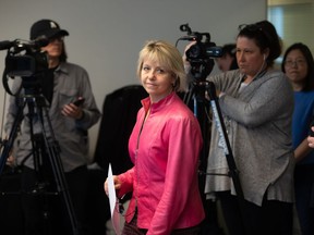 British Columbia provincial health officer Dr. Bonnie Henry arrives for a news conference to give an update on the coronavirus, in Vancouver, on Wednesday, March 18, 2020. British Columbia's provincial health officer apologized to her hairdresser on Tuesday for taking matters into her own hands during the COVID-19 pandemic.