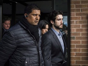 Marco Muzzo (right) leaves the Newmarket courthouse surrounded by family on Thursday, February 4, 2016.