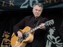 John Prine plays at the Edmonton Folk Festival in 2005.