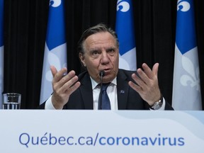 Quebec Premier Francois Legault responds to reporters during a news conference on the COVID-19 pandemic, Friday, April 17, 2020 at the legislature in Quebec City.