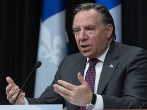 Quebec Premier Francois Legault announces his intention to re-open primary schools in tow weeks, during a news conference on the COVID-19 pandemic, Monday, April 27, 2020 at the legislature in Quebec City.