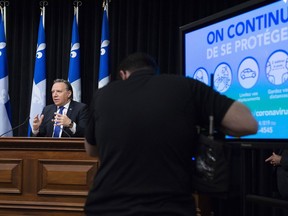 Quebec Premier Francois Legault announces the number of victims during a news conference on the COVID-19 pandemic, Thursday, April 30, 2020 at the legislature in Quebec City.