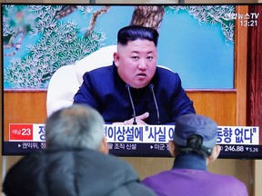 South Korean people watch a TV broadcasting a news report on North Korean leader Kim Jong Un in Seoul, South Korea, April 21, 2020.