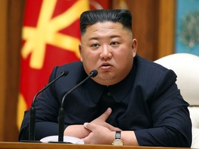 This picture taken on April 11, 2020 and released from North Korea's official Korean Central News Agency (KCNA) on April 12, 2020 shows North Korean leader Kim Jong Un speaks during a meeting of the Political Bureau of the Central Committee of the Workers' Party of Korea (WPK)  in Pyongyang