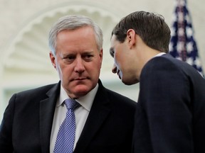 White House Acting Chief of Staff Mark Meadows listens to White House senior advisor Jared Kushner during U.S. President Donald Trump's meeting with Florida Governor Ron DeSantis in the Oval Office at the White House in Washington, U.S., April 28, 2020.