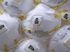 3M Co. 8210V N95 particulate respirators are arranged for a photograph in Hong Kong, China, on Monday, April 6, 2020.