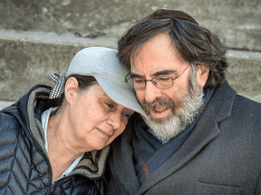 Rachel and Zale Newman sit out front of their Toronto home some five weeks after surviving COVID-19. Zale was unable to get doctors or healthcare workers anywhere near his wife, who was on a ventilator for 10 days.