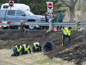 RCMP investigators search for evidence at the location where Const. Heidi Stevenson was killed along the highway in Shubenacadie, N.S. on Thursday, April 23, 2020.