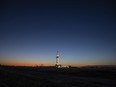An active oil drilling rig stands in Midland, Texas, U.S, on Thursday, April 23, 2020.