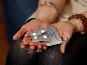 Naomi Connor, Co-Convener of Alliance for Choice poses with the recommended and safe medication that women in Northern Ireland are being denied.