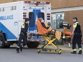 Paramedics arrive at the Toronto Western Hospital Emergency Centre during the COVI-19 pandemic, on April 1.