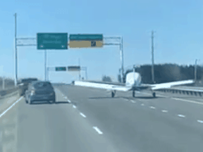 A small plane makes an emergency landing on Highway 40 in Quebec, on April 16, 2020.