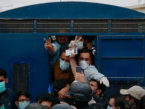 Policemen arrest doctors and paramedics who were protesting the unavailability of safety equipment, in Pakistan's southwestern city of Quetta, on April 6, 2020.