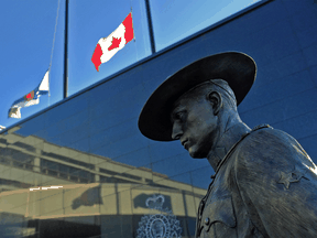 Flags of Nova Scotia and Canada fly at half-staff outside the Nova Scotia RCMP headquarters in Dartmouth, N.S., following a mass shooting in the province.